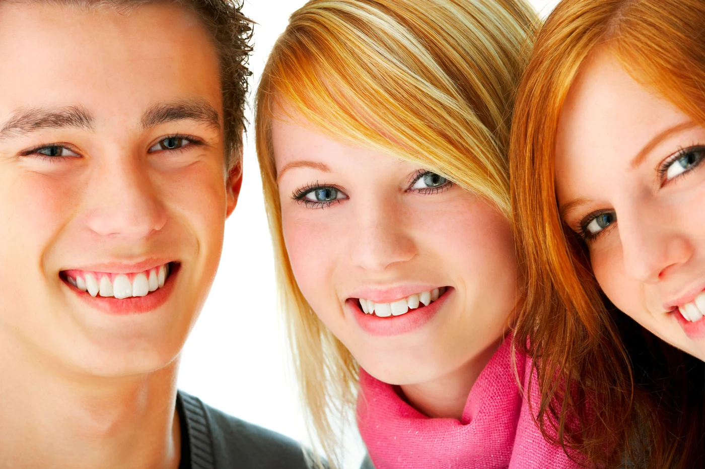 Three young people smiling together