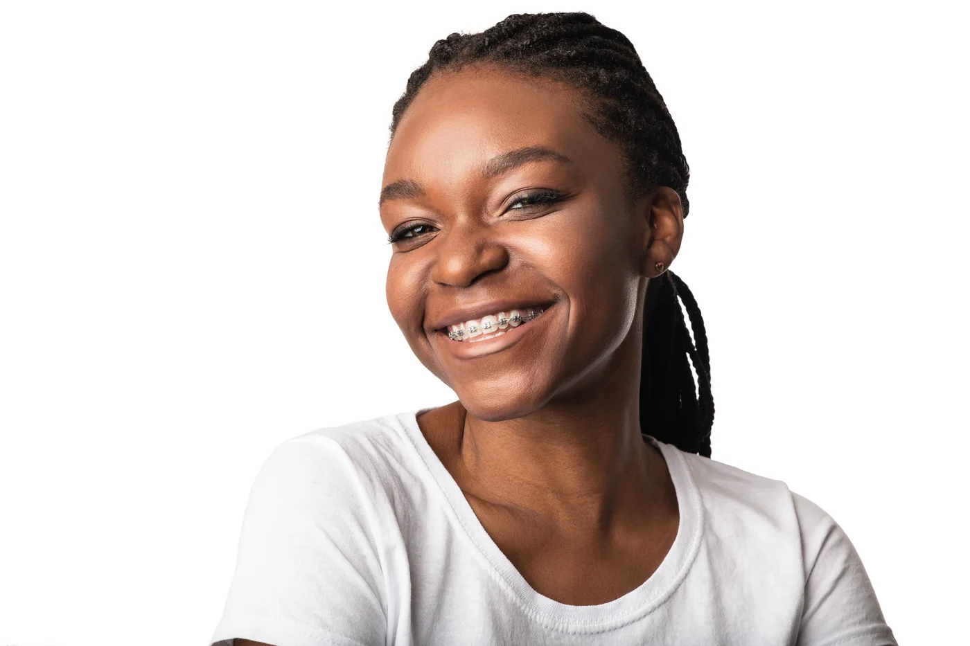 Smiling woman wearing braces and a white T-shirt