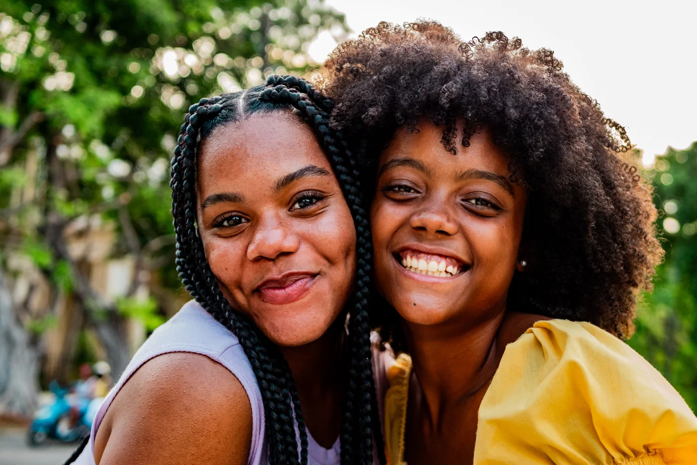 Two people smiling together outdoors